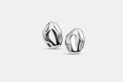 Pair of textured silver stud earrings with faceted rounded molten-look design