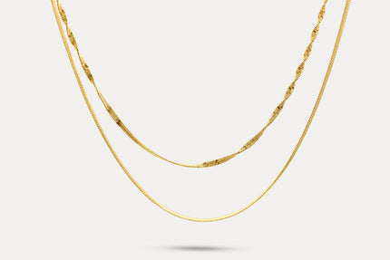Gold double-layer chain necklace with fine links and curved front