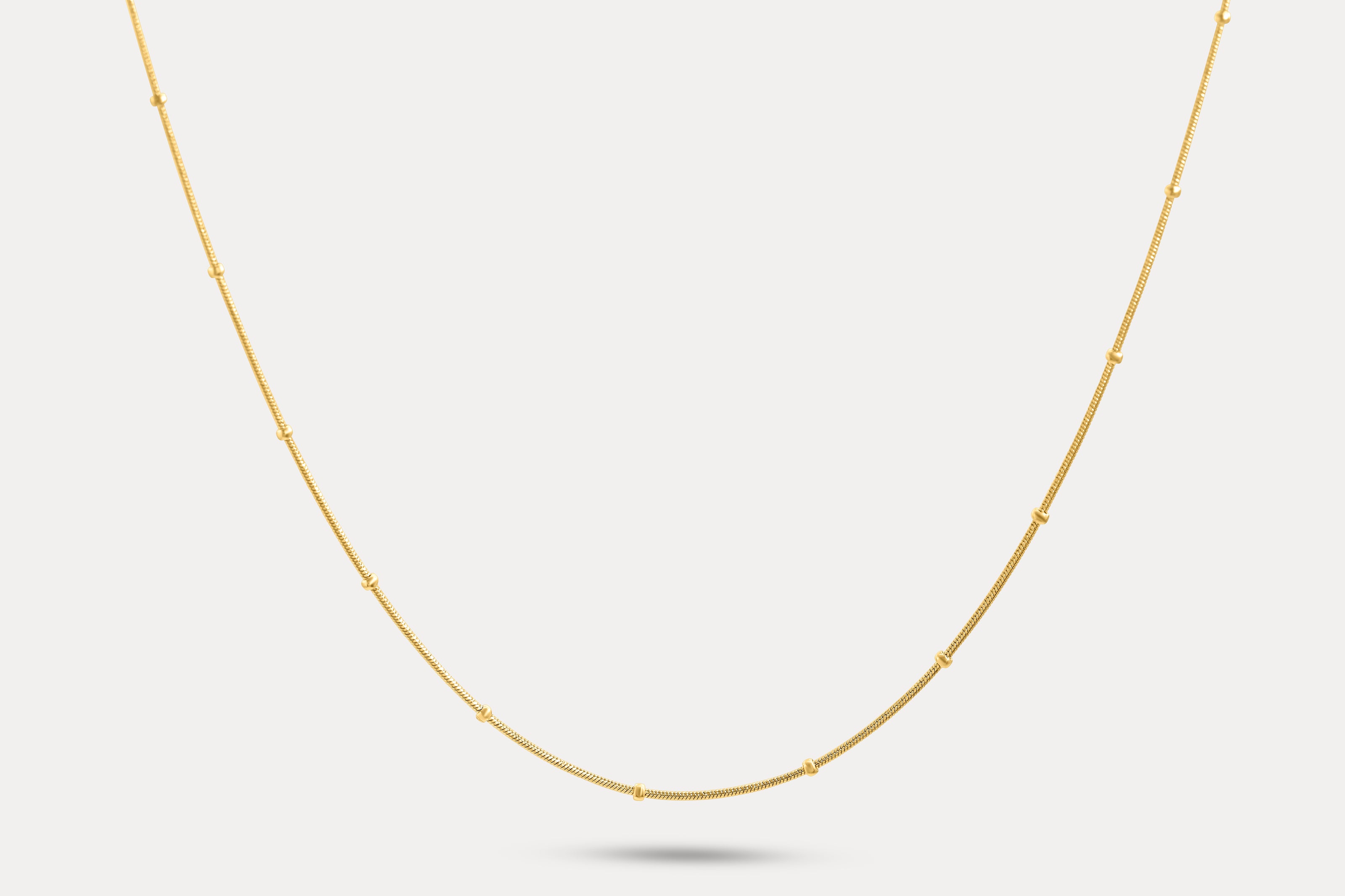Gold thin chain necklace with small bead-like segments