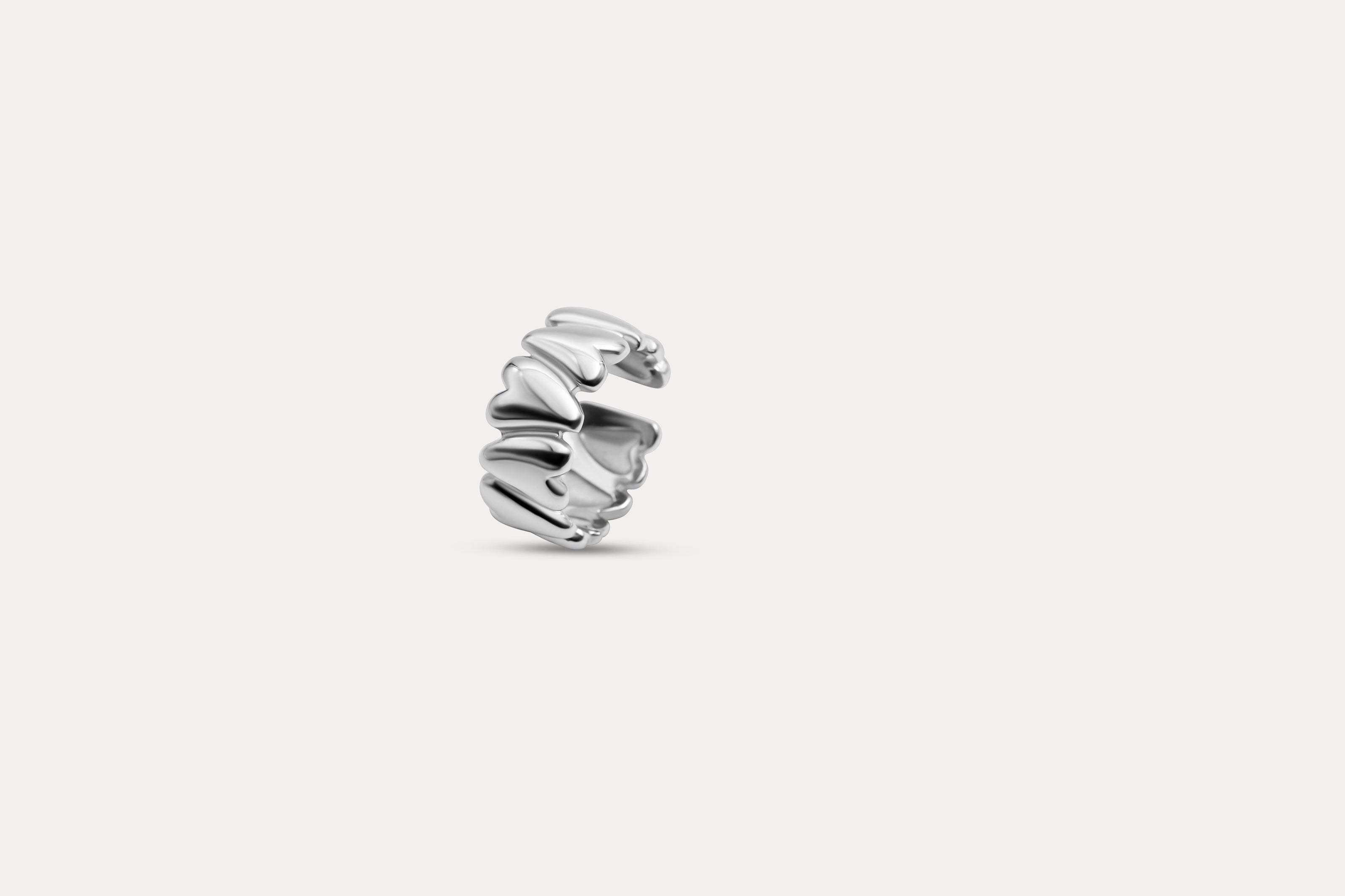 Silver sculpted heart ring with stacked heart band