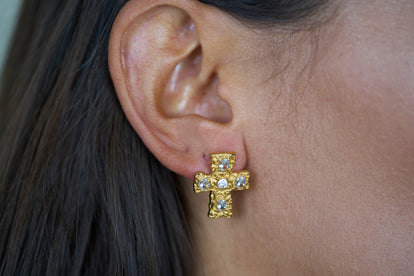Gold textured cross stud earrings with blue crystal stones